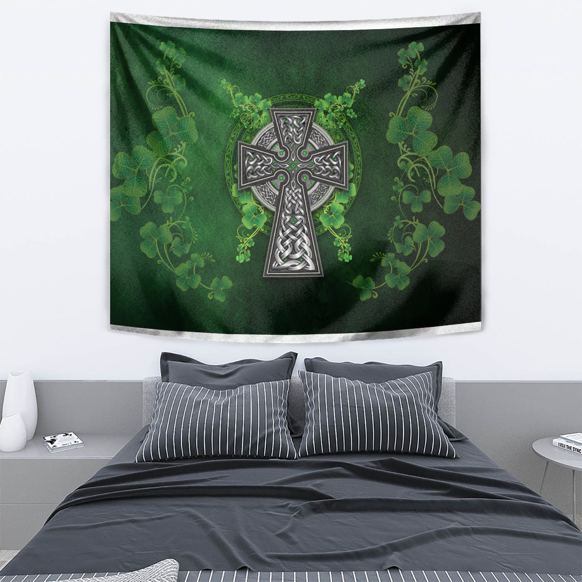 Green shamrock floral tapestry with a centered Celtic cross motif, hanging on a wall