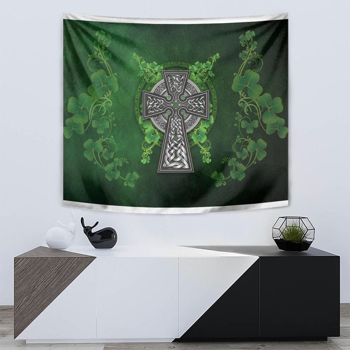 Decorative green tapestry with shamrock floral pattern and central Celtic cross in dark and silver tones