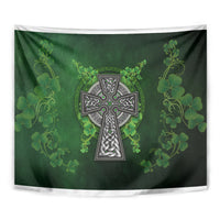 Green hanging tapestry with shamrock floral vines and central Celtic cross design in silver detail