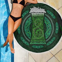 Round beach blanket with white fringe and dark green Celtic circle pattern