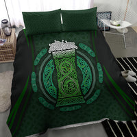 Black duvet cover with green Celtic circle beer cup motif, shown with two square pillowcases