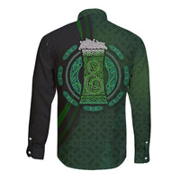 Long-sleeve button shirt with green celtic circle graphic on dark background