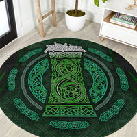 Round green rug with Celtic circle pattern and dark center medallion