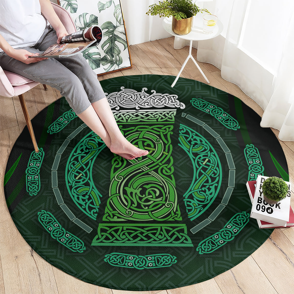 Round green rug with Celtic knot circle design, placed on wood floor