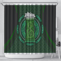 Black shower curtain featuring a large green Celtic circle and decorative beer-cup motif