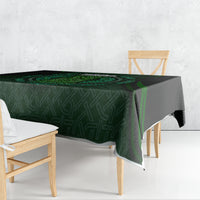 Green tablecloth with Celtic circle and beer cup pattern over dining table