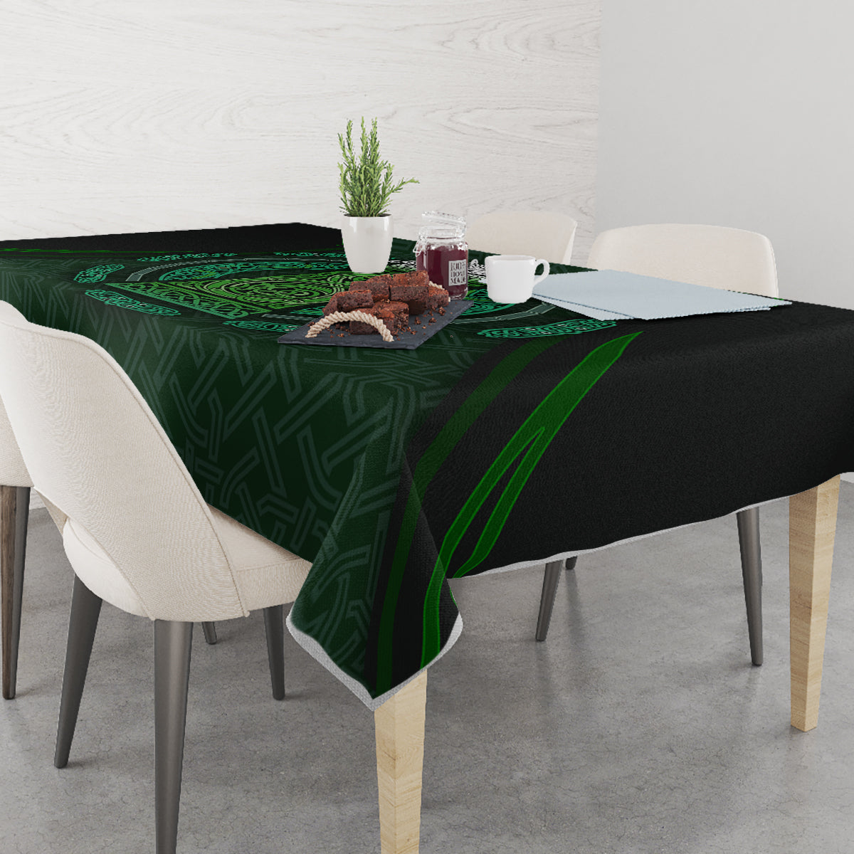 Green tablecloth with Celtic circle and beer cup motifs, draped over table edges