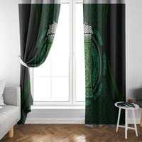 Green window curtain panels with Celtic circle beer cup design on dark fabric