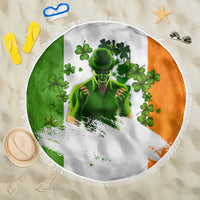 Round beach blanket with fringe edge, white center and green/orange clover leprechaun print
