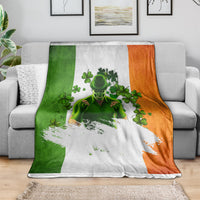 Leprechaun graphic blanket in green, white, and orange draped over a sofa