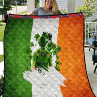 Irish-themed quilt with green, white, and orange blocks and clover-print figure