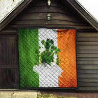 Irish-themed quilt framed indoors doorway, green white and orange clover figure design