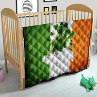 Irish-themed quilt in nursery on crib, green white and orange clover figure design