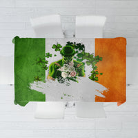 Multicolor Irish-themed tablecloth with green, orange, and white shamrock design.