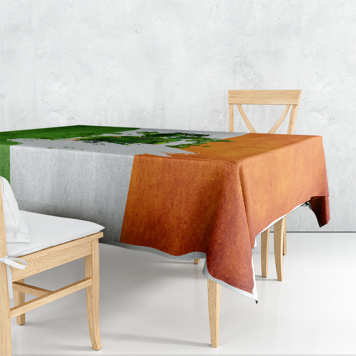 Multicolor tablecloth with green, orange, and white shamrock graphic; corner drape.