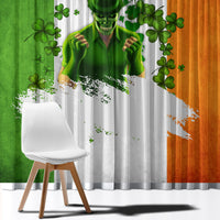 Close-up window curtains with a green illustrated face and clover motifs over gray fabric