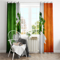 Window curtain pair with green and orange sides and a white clover graphic on gray fabric