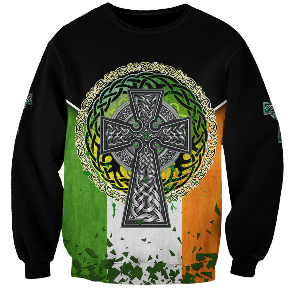 Unisex black sweatshirt with circular Celtic cross emblem, shamrock greenery, and Irish flag colors.