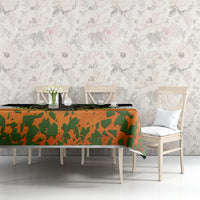 Irish-themed tablecloth with orange and green shamrock pattern and black top band.