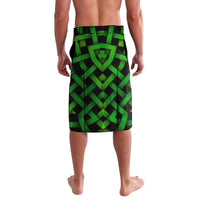 Green patterned knee-length shorts with Irish cross and clover graphic