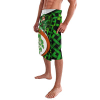 Green knee-length shorts with Irish cross, clover, and ribbon-like border print