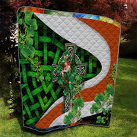 Irish-themed multicolor quilt with white cross motif, green clovers, and orange diamond accents