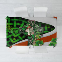 Decorative tablecloth with green shamrocks and Celtic knot motifs on orange and gray