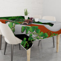 Decorative tablecloth featuring green clover leaves, orange panel, and Celtic accents