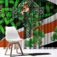 Window curtain panel with green clover artwork and orange accent triangle