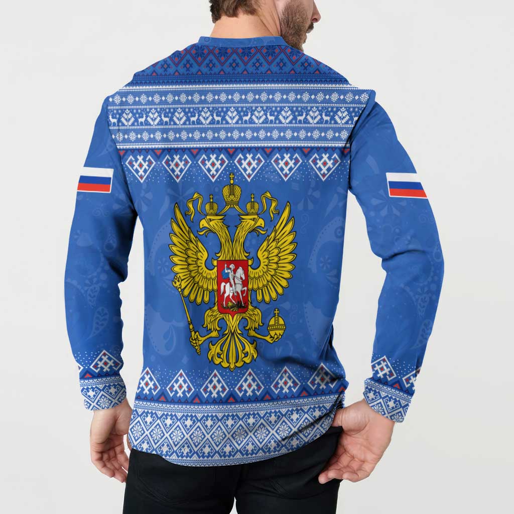 Blue button-front sweatshirt with back eagle emblem and white folk cuffs