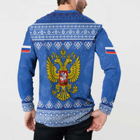 Blue button-front sweatshirt with back eagle emblem and white folk cuffs