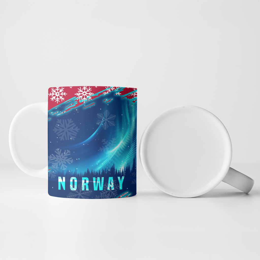 Blue ceramic mug side view with NORWAY text, northern lights, and snowflakes