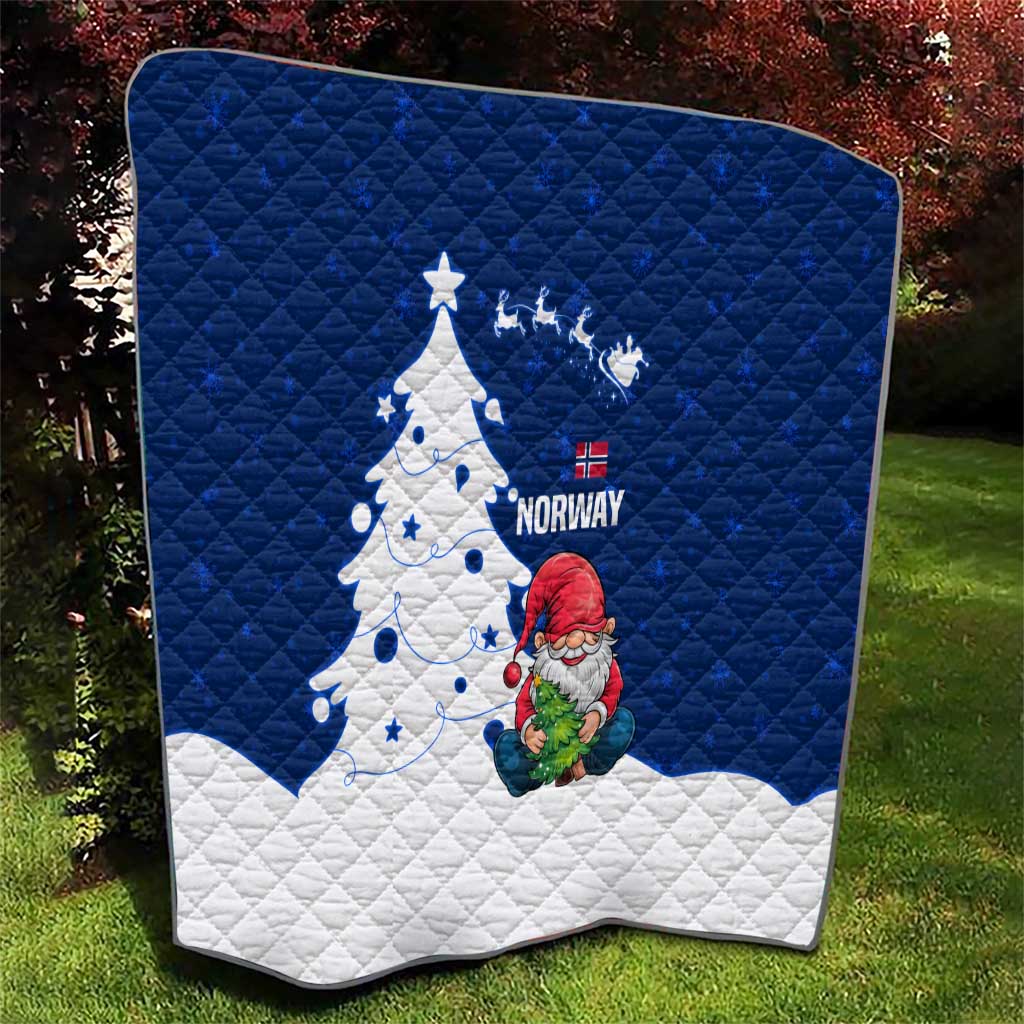 Blue and white quilt featuring Norway text, gnome Santa figure, and decorated Christmas tree