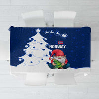 Blue holiday tablecloth with Norway gnome Santa, tree, and snowflake print