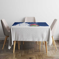 Blue square holiday tablecloth with Norway gnome Santa, tree, and snowflakes