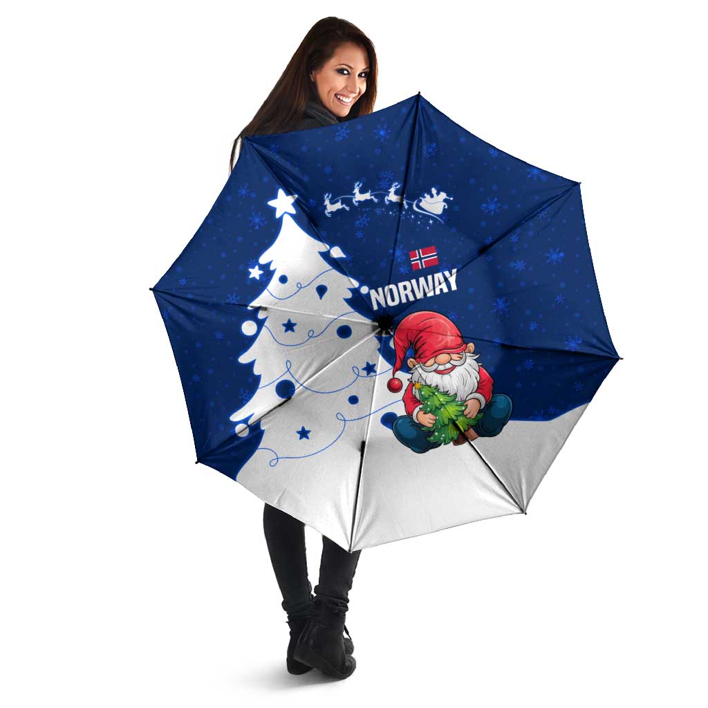 Blue and white Nordic Christmas umbrella held open with gnome Santa and Norway snowflake print