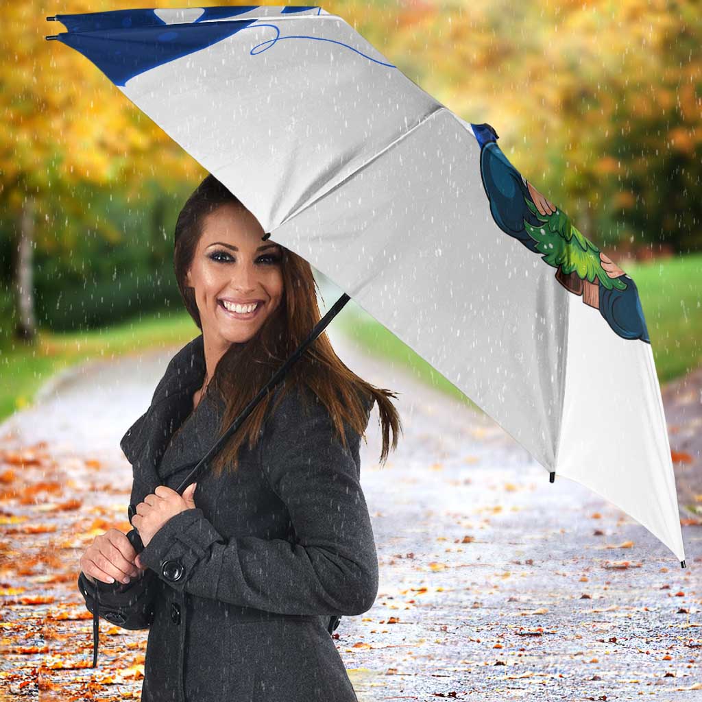 White umbrella canopy with blue Nordic gnome Santa design and snowflake details
