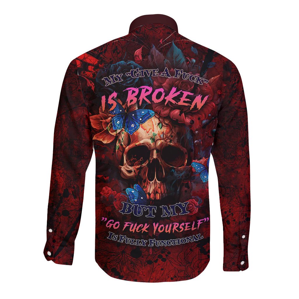 Red long-sleeve button shirt with skull and roses graphic on dark maroon fabric