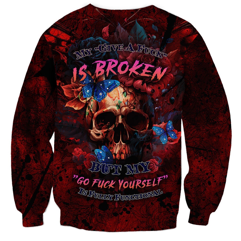 Unisex red grunge sweatshirt with skull, roses, and blue butterflies graphic on front