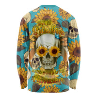 Long-sleeve graphic T-shirt with teal skull, sunflowers, and butterfly text graphic