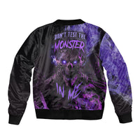 Black bomber jacket with purple monster graphic, ribbed collar and cuffs