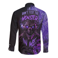 Unisex black long sleeve button shirt with purple monster graphic on back
