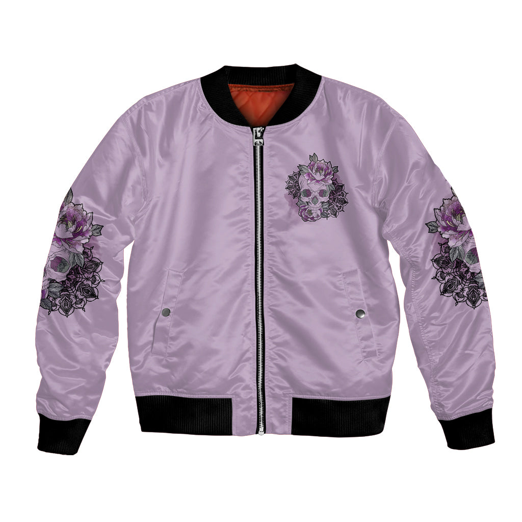 Lilac bomber jacket with front zipper, floral skull patch, ribbed black hem and cuffs