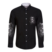Black long-sleeve button shirt with small skull graphic and sleeve art