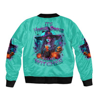 Turquoise bomber jacket with ribbed black collar and large back witch graphic