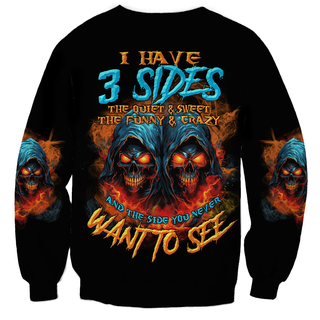 Black crewneck sweatshirt with 3-sided skull graphic and fiery text on back.