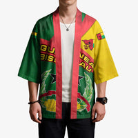 Unisex kimono worn by model, multicolor flag-style stripes and Guinea-Bissau crest