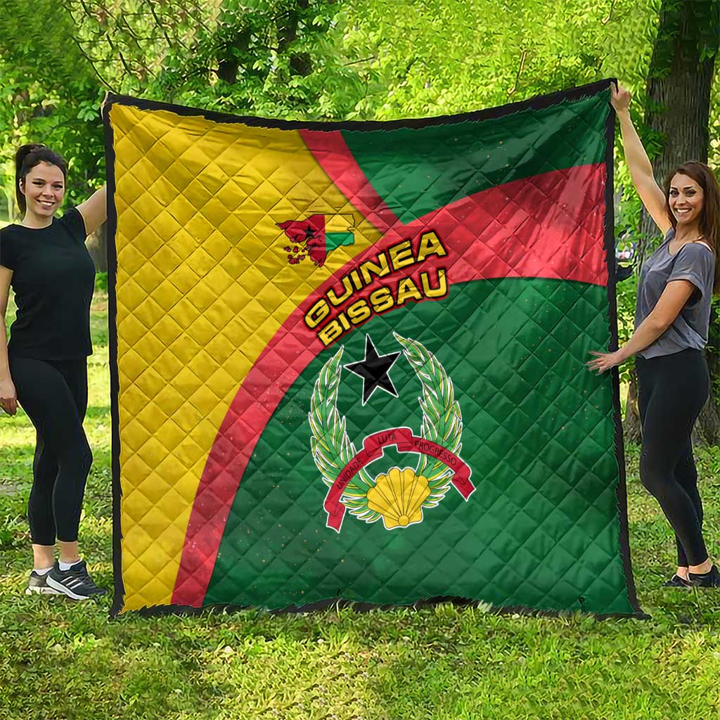 Guinea-Bissau quilt laid out flat, showing green red yellow swirl flag and crest emblem