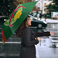 Open Guinea-Bissau umbrella with green, red, yellow panels and laurel crest logo