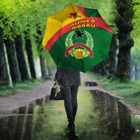Open Guinea-Bissau umbrella in green, red, and yellow with central star emblem